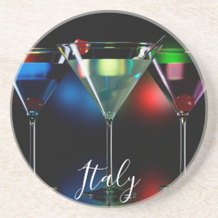 Different cocktails in martini glasses with lights coaster