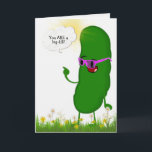 dill pickle with pink glasses for birthday card<br><div class="desc">Green dill pickle with bright pink eyeglasses  standing in grass and flowers for getting older birthday</div>