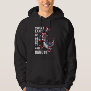 Dinosaur 4th of July T Rex eating doughnuts Funny Hoodie