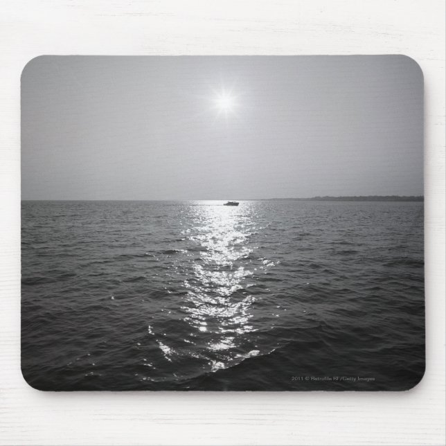 Distant boat on ocean mouse pad (Front)