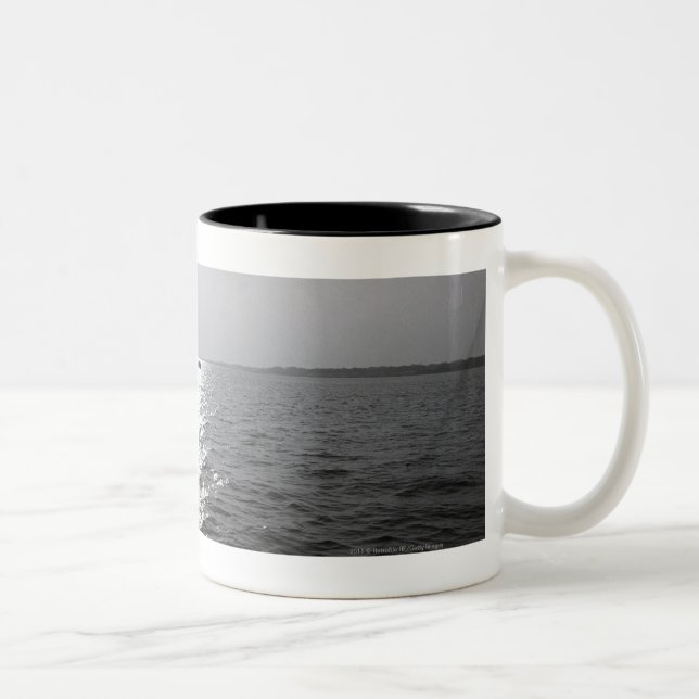 Distant boat on ocean Two-Tone coffee mug (Right)