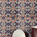 Distressed Stone Texture Ethnic Mosaic Geometric Tile<br><div class="desc">This ceramic tile is adorned with a mesmerizing geometric pattern that exudes a sense of cultural richness and artistic flair. The design features a symmetrical array of shapes that draw inspiration from tribal or ethnic motifs, creating a tapestry of visual intrigue. The colour palette is a sophisticated blend of purple,...</div>