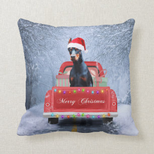 Doberman Dog in Snow sitting in Christmas Truck Throw Pillow