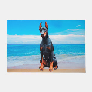 Doberman Dog Sitting On Beach Doormat