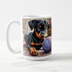 Doberman Puppy with Yarn Ball on a Colourful Rug Coffee Mug
