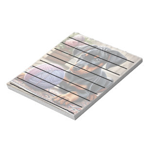 Doberman Puppy with Yarn Ball on a Colourful Rug Notepad