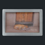 Dog at Rest Belt Buckle<br><div class="desc">Dog at Rest Nature Photo prints and gifts feature a beautiful photograph of tan dog sleeping in front of a mud hut with an orange door in Africa taken by Kurt Keller in the afternoon while on an African safari. Anyone who loves animals, dogs, nature photography and any puppy lovers...</div>