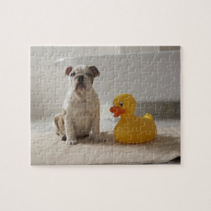 Dog on mat with plastic duck jigsaw puzzle