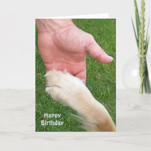 dog paw in man's hand for birthday card