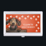 Dog Walker Paw Prints Business Card Holder<br><div class="desc">This business card holder,  personalized with your name,  features a cute Dachshund on bright orange with a white paw print border. Fun as a gift or a great way to carry your own business cards.</div>