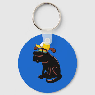 Dog wearing sunglasses and a yellow hat keychain