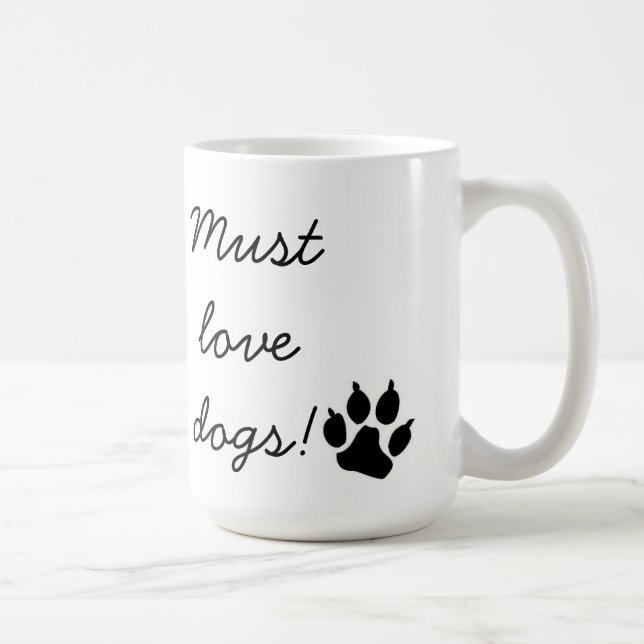Doit aimer la tasse noire d'empreinte de patte de (Droite)