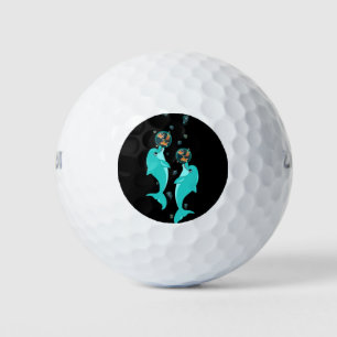 dolhpins playing with water baloons golf balls