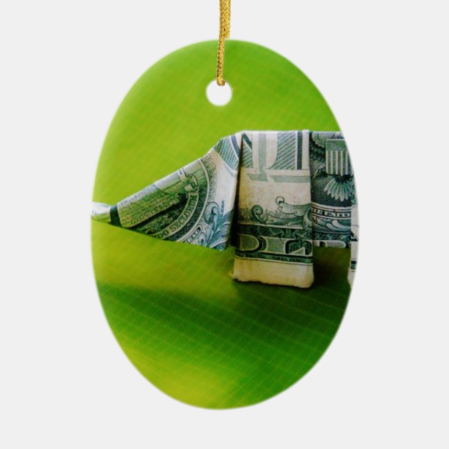 Dollar bill origami Elephant on Green background Ceramic Ornament (Front)