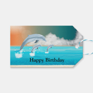 dolphins breaching in the ocean         gift tags