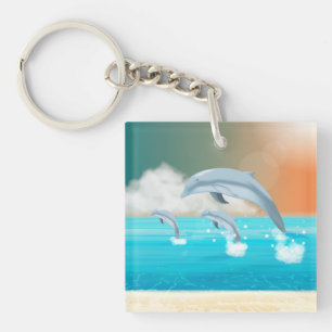 dolphins breaching in the ocean keychain