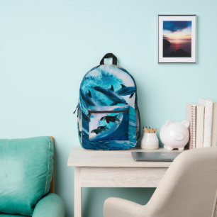Dolphins riding the waves printed backpack