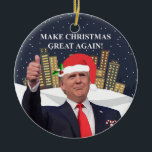 Donald Trump Christmas Tree Ornament<br><div class="desc">Decorate your tree with patriotic pride and Make Christmas Great Again! This ceramic Christmas Tree ornament is adorned with Trump's iconic thumbs-up gesture with a snowy winter city skyline in the background and the slogan MAKE CHRISTMAS GREAT AGAIN, a festive take on the Trump / Pence 'Make America Great Again'...</div>