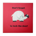 Don't forget to lock the door. tile<br><div class="desc">Elephant with ribbon tied around it's trunk and message: "Don't forget to lock the door."</div>