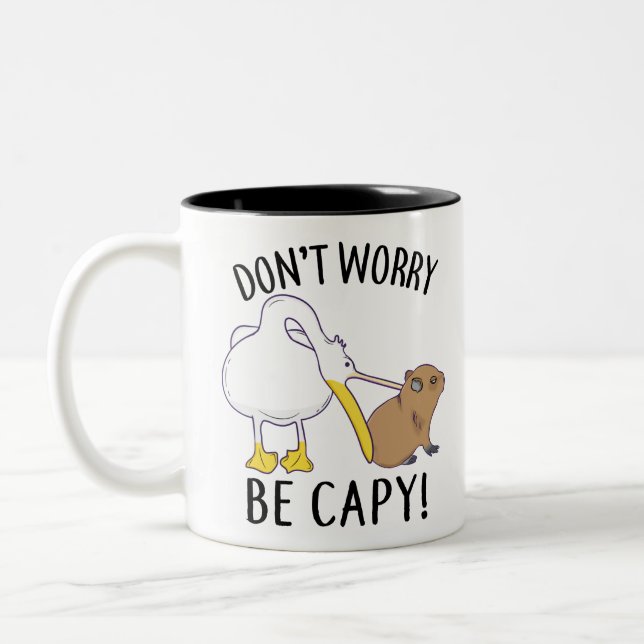 Don't Worry, Be Capy. Capybara Orange Unbothered Two-Tone Coffee Mug (Left)