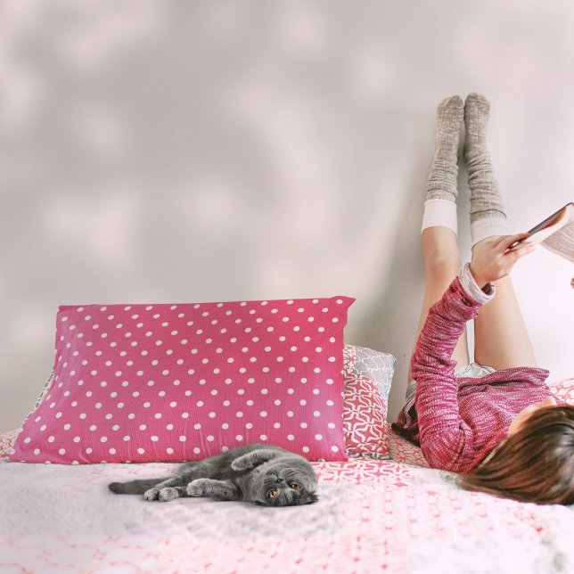 Dotty Delight Red Accent Pillow (A girl is beside a Dotty Delight Red Accent Pillow on the bed.)