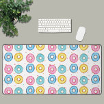 Doughnut  desk mat<br><div class="desc">This fun desk mat is decorated with a doughnut pattern of pink,  blue,  turquoise,  and yellow doughnuts on a colourful sprinkle background. Perfect for your favourite doughnut lover!
Original Watercolor Doughnuts © Michele Davies.</div>
