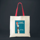 Dr. Seuss El Gato Ensombrerado Spanish Tote Bag<br><div class="desc">This authentic Dr. Seuss product features the classic Cat in the Hat character alongside the Spanish title of the beloved book, "El Gato Ensombrerado." The design highlights the iconic, smiling feline wearing his signature tall red and white striped hat and red bow tie, set against a vibrant blue background. It...</div>