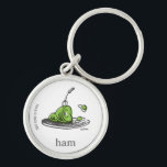 Dr. Seuss | Green Eggs and Ham Keychain<br><div class="desc">This officially licensed Dr. Seuss design features a fun, classic illustration of the iconic green eggs and ham on a platter. The artwork highlights the famous green ham with a fork resting inside, alongside the bouncing green eggs, and is finished with the simple word "ham" and the authentic Dr. Seuss...</div>