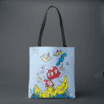 Dr. Seuss | Green Eggs & Ham Scene Tote Bag<br><div class="desc">This officially licensed product features a vibrant illustration from Dr. Seuss's classic children's book, Green Eggs and Ham. The scene captures the chaotic action of the story over blue water. At the top, the yellow text reads 'Green Eggs and Ham'. Sam-I-Am is shown floating with a serving platter of green...</div>