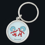 Dr. Seuss Thing 1 and Thing 2 Character Keychain<br><div class="desc">This officially licensed Dr. Seuss product features a classic, vibrant illustration of the mischievous duo, Thing 1 and Thing 2, from the iconic book The Cat in the Hat. The design showcases the lively pair mid-dance, complete with their signature wild blue hair, bright red jumpsuits, and circular name emblems on...</div>
