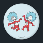 Dr. Seuss Thing 1 and Thing 2 Character Magnet<br><div class="desc">This officially licensed Dr. Seuss product features a classic, vibrant illustration of the mischievous duo, Thing 1 and Thing 2, from the iconic book The Cat in the Hat. The design showcases the lively pair mid-dance, complete with their signature wild blue hair, bright red jumpsuits, and circular name emblems on...</div>