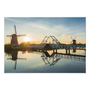 Drawbridge and windmills at sunset in Holland Photo Print