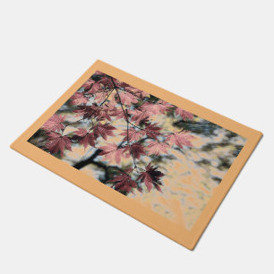 Drawing of a branch with pink fall leaves doormat