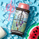 Dreamcatcher in Window | Boho Art Seltzer Can Cooler<br><div class="desc">Boho can cooler.  A rustic wood window with a white,  orange and purple feathered dreamcatcher hanging in the window along with a string of colourful crystals. The window overlooks a beautiful scene of forest and mountains.</div>
