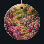 Dreamy Pink Flower Garden Path Painting Ceramic Ornament<br><div class="desc">A vibrant, dreamy garden scene filled with lush pink and purple flowers under warm golden sunlight. A charming toolbox overflowing with blooming roses sits beside a winding garden path, creating a whimsical and symbolic atmosphere. With painterly brushstrokes and rich floral colors, this artistic design captures the beauty of nature, growth,...</div>