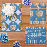 Dreidel Rustic Oak Cute Blue Photo Hanukkah Wrapping Paper Sheet<br><div class="desc">Create your own Hanukkah wrapping paper sheets with two personalized designs in the three design assortment. All based around rustic dreidels in a faux oak wood graphic, the first sheet is a series of jumbo dots in rich blue on a background of pale pastel blue. Add your photo into the...</div>