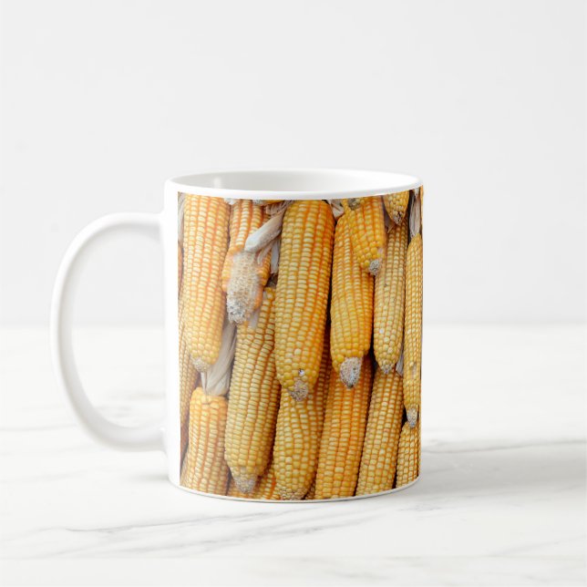 Dried corn that was stacked . coffee mug (Left)