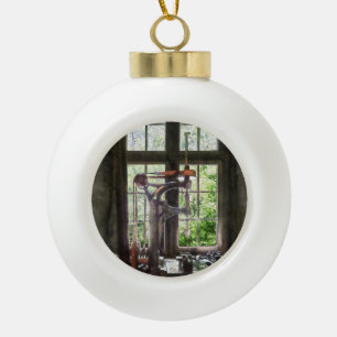 Drill Press by Window Ceramic Ball Christmas Ornament