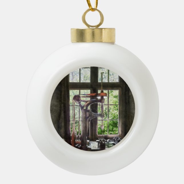 Drill Press by Window Ceramic Ball Christmas Ornament (Front)