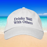 Drinks Well With Others Funny Preppy Wine Baseball Embroidered Hat<br><div class="desc">Add a playful and stylish touch to your outfit with this “Drinks Well With Others” embroidered baseball hat. Featuring classic navy blue stitching on a crisp white cap, this preppy and humourous design is perfect for wine lovers who enjoy a good time with friends. Whether you're heading to brunch, a...</div>