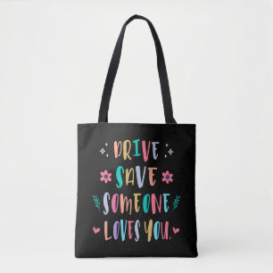 Drive safe someone loves you tote bag