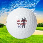 Driving Golf Hard at 60 Golf Balls<br><div class="desc">Fun birthday present for the man who is turning the big 60! Featured on this custom golf ball is a grey silhouette golfer in full swing. Red and blue text says "Still driving it HARD at 60". Sure to be a favourite on the course!</div>