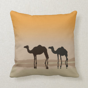 Dromedary camels and a mirage throw pillow