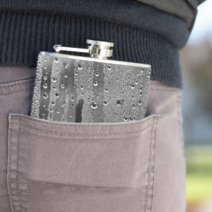 Drops of rain on window hip flask