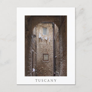 Drying laundry in Tuscany white text postcard