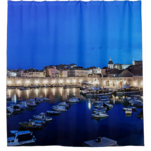 Dubrovnik harbor and walls illuminated at night