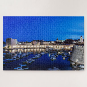 Dubrovnik harbor and walls illuminated at night jigsaw puzzle