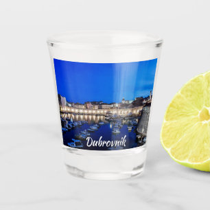 Dubrovnik harbor and walls illuminated at night shot glass