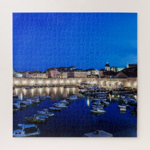 Dubrovnik harbour and walls illuminated at night jigsaw puzzle