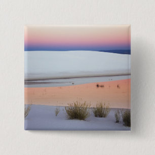 Dusk sky reflected in pool of water from 2 inch square button
